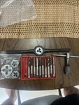 Greenfield & Set Assorted Round Dies, Taps, Wrench Holder. Fixed Price $100.00.